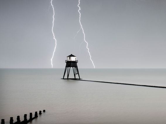 CDCROP: Lighthouse ocean lightning strikes (Historic England Archive/Heritage Images via Getty Images)