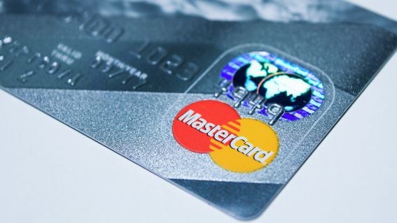 close up of Mastercard logo and hologram on a payment card