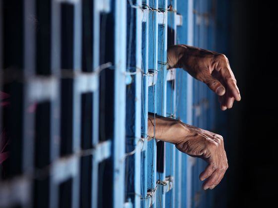 CDCROP: Man arrested behind bars in jail (Shutterstock)