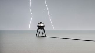 CDCROP: Lighthouse ocean lightning strikes (Historic England Archive/Heritage Images via Getty Images)