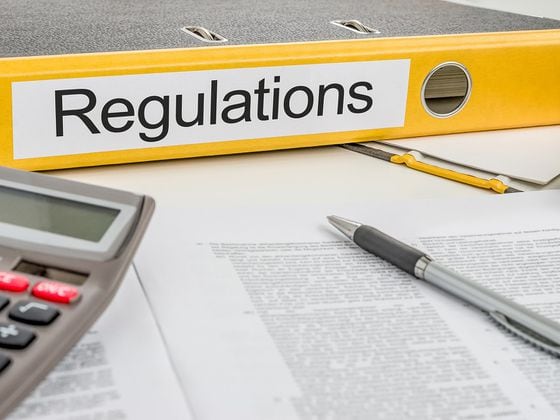 Regulations paperwork binder (Shutterstock)