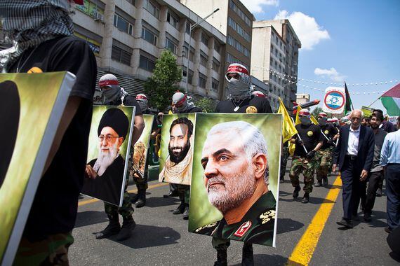 Parade of military forces, along with photographs of Qasem Soleimani, Tehran, Iran, May 31, 2019. (Image via Shutterstock)