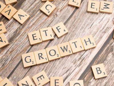 Scrabble tiles spelling out "ETF GROWTH"