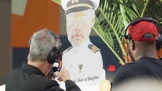 MicroStrategy Executive Director Michael Saylor snaps a photo of a cardboard cutout of himself at Bitcoin Miami 2022. (Danny Nelson/CoinDesk)