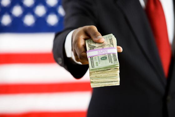 US flag and man with dollars