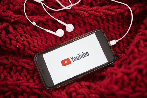 The logo for YouTube Inc. is displayed on a smartphone in an arranged photograph taken in the Brooklyn borough of New York, U.S., on Sunday, May 10, 2020. The video arm of Alphabet Inc.'s Google is offering new tools and audience statistics specifically for advertising on TV - screen space where YouTube has trailed cable channel. Photographer: Gabby Jones/Bloomberg via Getty Images