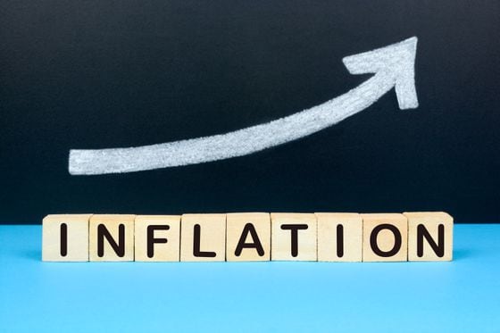 Concept of Inflation. Rising chart on the background with the text inflation.