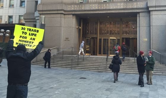  Protestors held signs outside of the New York City courthouse where Ulbricht's trial began on Tuesday.