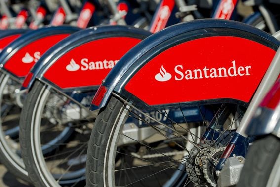 a row of parked, Santander-sponsored bicycles, aka Boris bikes.