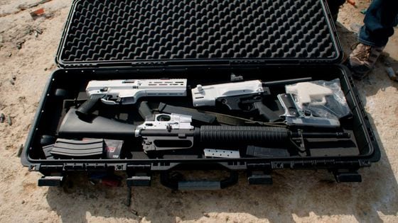 Case full of guns, in a scene from "Death Athletic." (Jessica Solce)