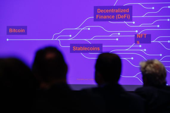 Audience members view a graphic showing trends driving the crypto ecosystem growth during a presentation at the Chainalysis Links conference in London, U.K., on Thursday, Feb. 24, 2022. The conference is hosted by crypto research firm Chainalysis Inc. Photographer: Luke MacGregor/Bloomberg via Getty Images