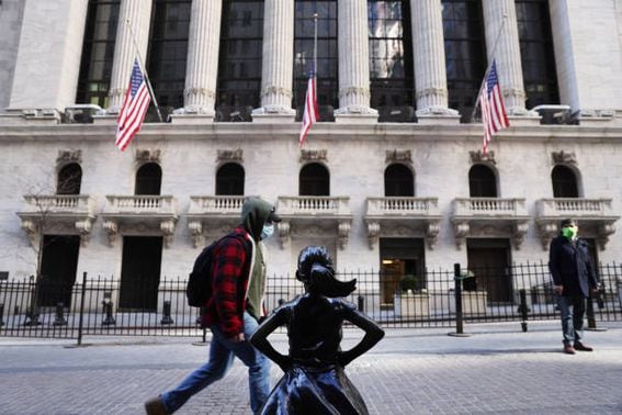 People walking by the New York Stock Exchange (Spencer Platt/Getty Images)