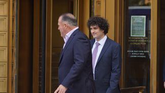 Sam Bankman-Fried (right) exits the courtroom in Manhattan after a hearing on July 26, 2023. (Nikhilesh De/CoinDesk)