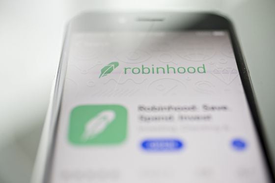 Photo of a mobile phone with a Robinhood screen displayed.