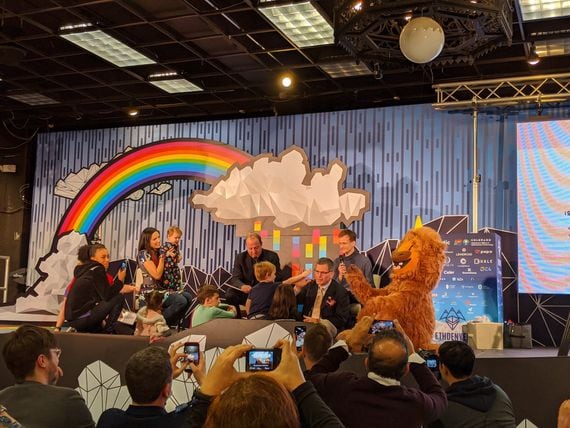 Colorado Gov. Jared Polis and Ethereum creator Vitalik Buterin read children's books at ETHDenver 2020. (Photo by Will Foxley for CoinDesk)