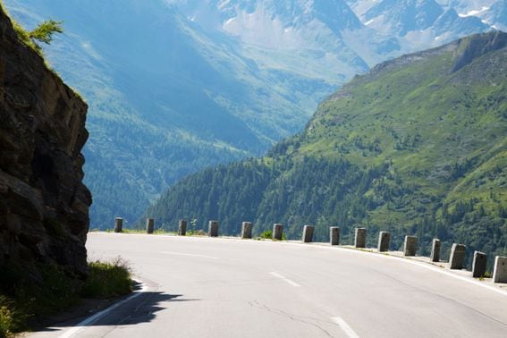 Grossglockner high alpine road with milestone markers, Austria. Representing Ethereum Beacon Chain staking milestone.