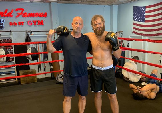 Nikolai Yakovenko, right, and his trainer after a workout at a Miami Beach boxing gym.