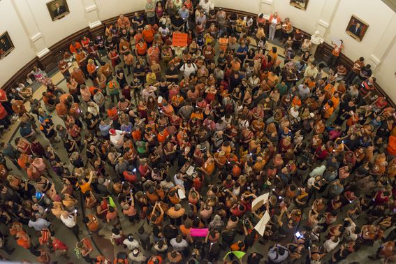 Protesters gather outside the Senate Gallery minutes before midnight to stall Senate Bill 5, a bill that would put strict regulations on abortion facilities, from going to a vote at the Texas State Capitol. Photo by Lauren Gerson.