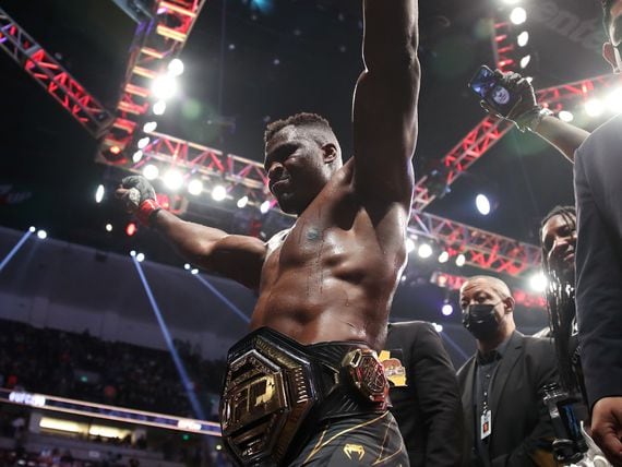 Francis Ngannou of Cameroon celebrates after defeating Ciryl Gane of France by unanimous decision in their heavyweight title fight during the UFC 270 event at Honda Center on January 22, 2022 in Anaheim, California.