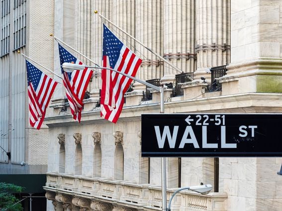 CDCROP: Wall Street sign with american flags and New York Stock Exchange in Manhattan, New York City, USA. (Getty Images)