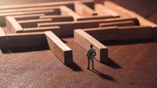 miniature business man maze solution concept photo