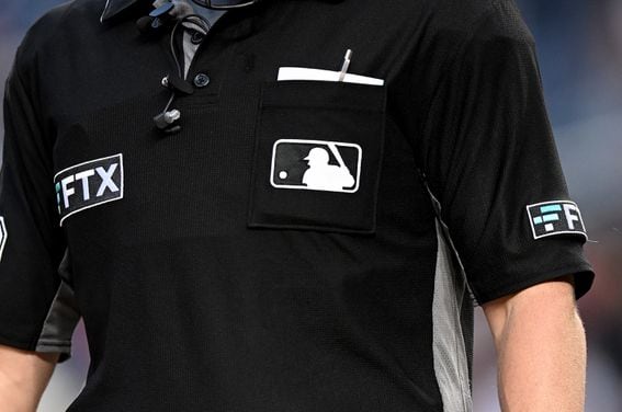 Major League Baseball referees wore FTX-branded kits. (G Fiume/Getty Images)