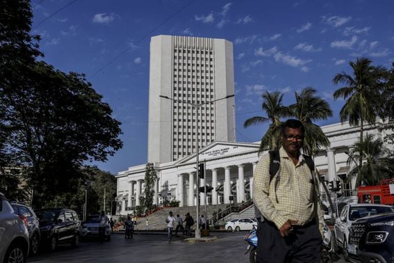 A pedestrian walks past the Reseve Bank of India (RBI) in Mumbai, India (Dhiraj Singh/Bloomberg via Getty Images)