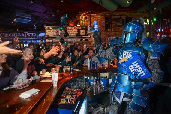 Bud Light's Bud Knight hands out beer at Chickie's and Pete's in Philadelphia.