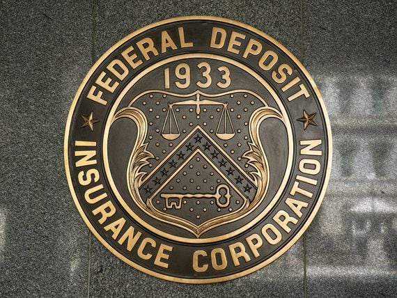 WASHINGTON, DC - JUNE 6:  The entrance to the Federal Deposit Insurance Corporation (FDIC), located across the street from the Eisenhower Executive Office Building, is viewed on June 6, 2017 in Washington, D.C. The nation's capital, the sixth largest metropolitan area in the country, draws millions of visitors each year to its historical sites, including thousands of school kids during the month of June. (Photo by George Rose/Getty Images)
