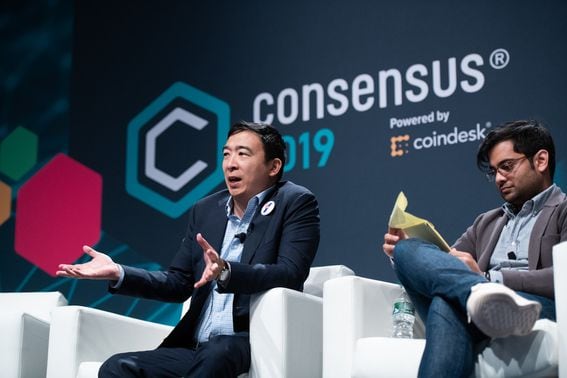 Andrew Yang (left) 
at Consensus 2019