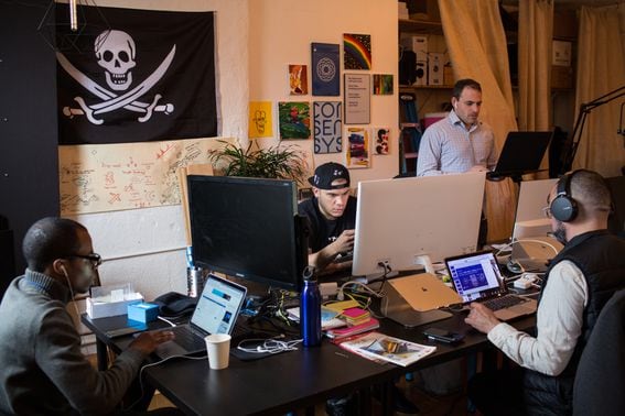 Employees work on computers at the ConsenSys office in Brooklyn on Thursday, March 29, 2018. (Holly Pickett/Bloomberg via Getty Images)