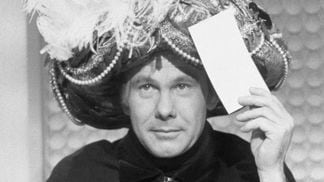 Johnny Carson making a prediction as "Carnac the Magnificent" (Getty Images)