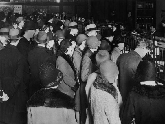 Investors rush to withdraw their savings during a stock market crash, circa 1929. (Hulton Archive/Getty Images)