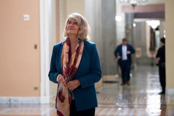 Sen. Cynthia Lummis (R-Wyo.) walks the halls of the Capitol outside the Senate chamber on Aug. 10, 2021.