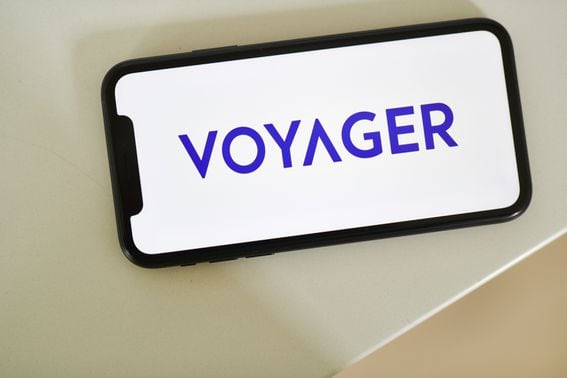 The Voyager Digital Ltd. logo on a smartphone arranged in Little Falls, New Jersey, U.S., on Saturday, May 22, 2021. Elon Musk continued to toy with the price of Bitcoin Monday, taking to Twitter to indicate support for what he says is an effort by miners to make their operations greener.