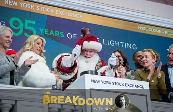 Santa Claus rings the closing bell with Christie Brinkley at the New York Stock Exchange, related to today’s topic of a possible Santa Claus rally.
