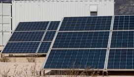 Solar panels and mining rig. (Eliza Gkritsi/CoinDesk)