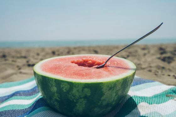 Half of a watermelon on the beach