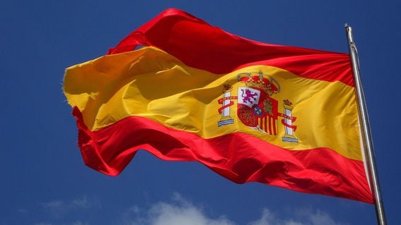 Spanish flag waving by the wind.