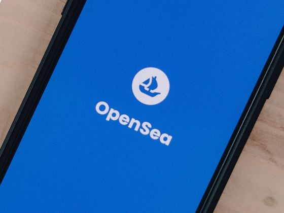 OpenSea logo on phone (Unsplash)