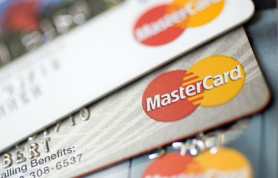 Mastercard logos appear on credit cards arranged for a photograph