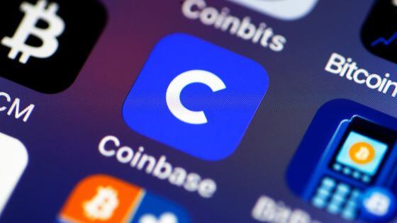 PARIS, FRANCE - FEBRUARY 26: In this photo illustration, the Coinbase cryptocurrency exchange logo (C) is seen on the screen of an iPhone on February 26, 2021 in Paris, France. Cryptocurrency trading platform Coinbase has filed for registration with the SEC on Thursday for an IPO via direct listing on the Nasdaq and will likely be the largest IPO of the year. Coinbase reported $ 1.28 billion in revenue in 2020 (+ 140% year on year), for net profit of $ 320 million. (Photo illustration by Chesnot/Getty Images)