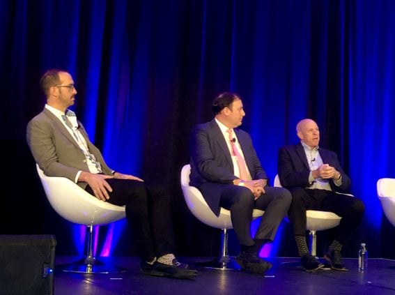 Silvergate Bank CEO Alan Lane (right) speaks on a panel in New York. (Photo via CoinDesk archives)