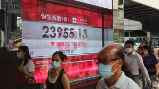 An electronic screen displays the Hang Seng Index in the Central district of Hong Kong, China Monday, Sept. 20, 2021.