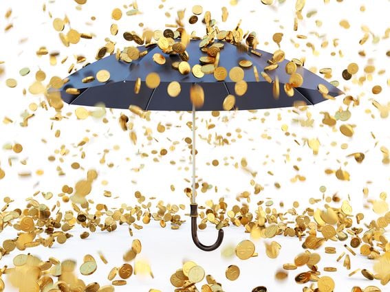 CDCROP: Coins raining down on an umbrella (Getty Images)