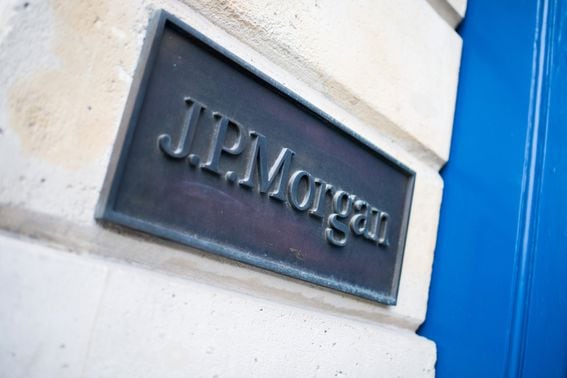 A plaque at the entrance to the JPMorgan Chase & Co. headquarters on Place Vendome in Paris, France, on Monday, Dec. 20, 2021. While Paris is winning the fight for lucrative trading jobs, other places such as Frankfurt, Dublin and Amsterdam are emerging as EU financial hubs in their own right, just for different specialisms.