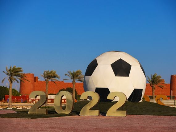 AL RUWAIS, QATAR - OCTOBER 10: A roundabout in the town of Al Ruwais in the North of Qatar, the host venue for the Qatar 2022 FIFA World Cup, decorated with 2022 signage and a giant football on October 10, 2021 in Doha, Qatar. (Photo by Robbie Jay Barratt - AMA/Getty Images)