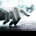 Robot concept or robot hand chatbot pressing computer keyboard enter (Getty Images)