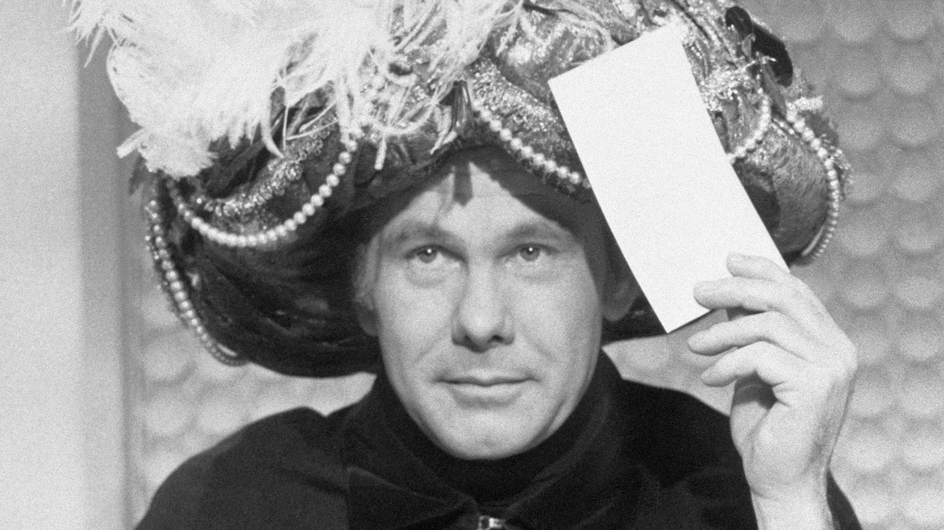 Johnny Carson making a prediction as "Carnac the Magnificent" (Getty Images)