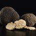 CDCROP: Black truffles and slices on black (Getty Images)